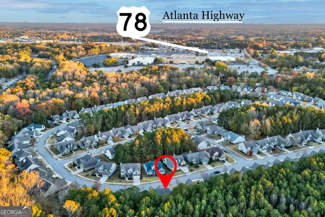 a view of a house with a porch and a backyard