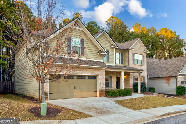 a view of staircase with wooden floor and fan
