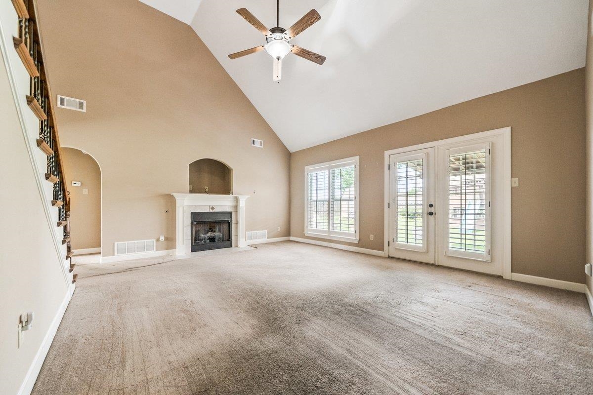 583 Rosemark Road Atoka, TN 38004 - Photo 13 of 25 a view of an empty room with a fireplace and a window