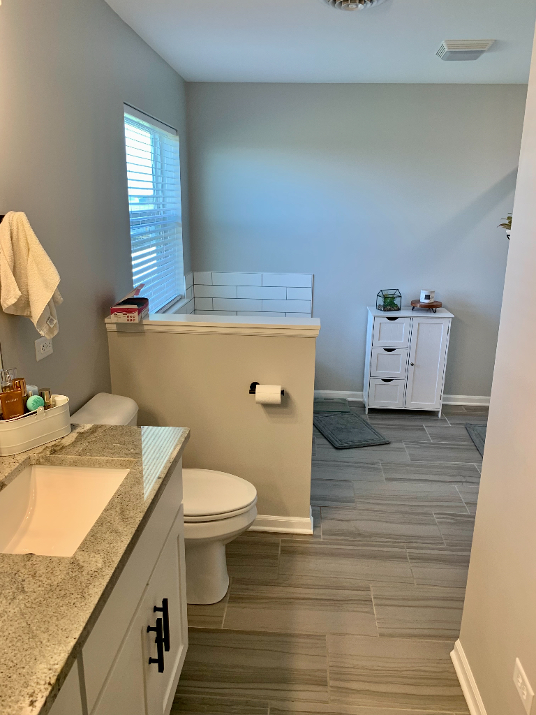 1493 North 3045th Road Ottawa, IL 61350 - Photo 20 of 23 a bathroom with a granite countertop toilet sink and mirror