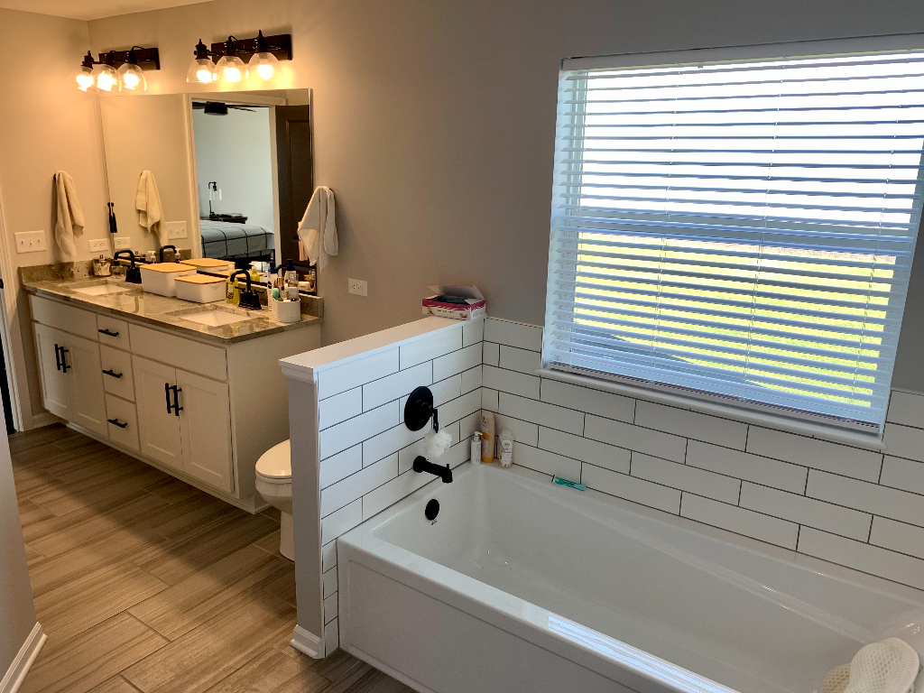 1493 North 3045th Road Ottawa, IL 61350 - Photo 21 of 23 a bathroom with a double vanity sink mirror and bathtub