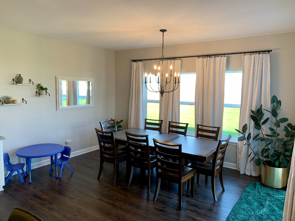 1493 North 3045th Road Ottawa, IL 61350 - Photo 6 of 23 a view of a dining room with furniture window and wooden floor
