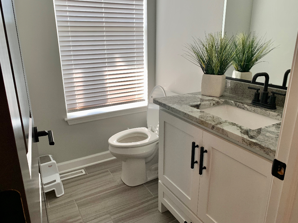 1493 North 3045th Road Ottawa, IL 61350 - Photo 7 of 23 a bathroom with a granite countertop sink toilet and mirror