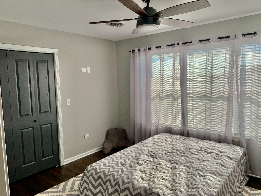 1493 North 3045th Road Ottawa, IL 61350 - Photo 9 of 23 a bedroom with a bed and a window