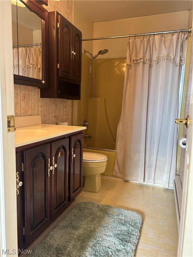 5406 McCartney Road Sandusky, OH 44870 - Photo 17 of 17 Full bathroom featuring toilet, tile floors, shower / tub combo, and vanity