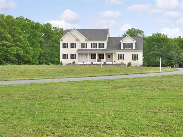 14 Hatch Road Wrentham, MA 02093 - Photo 1 of 28 a front view of a house with a yard