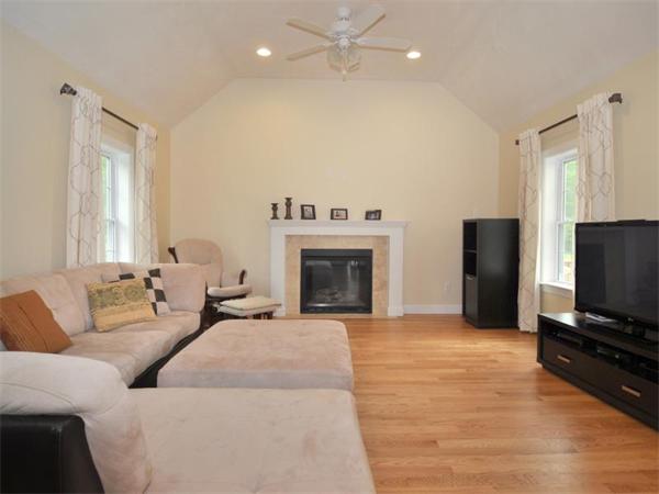 14 Hatch Road Wrentham, MA 02093 - Photo 11 of 28 a living room with furniture and a flat screen tv