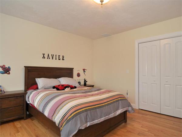 14 Hatch Road Wrentham, MA 02093 - Photo 20 of 28 a bedroom with a bed and wooden floor