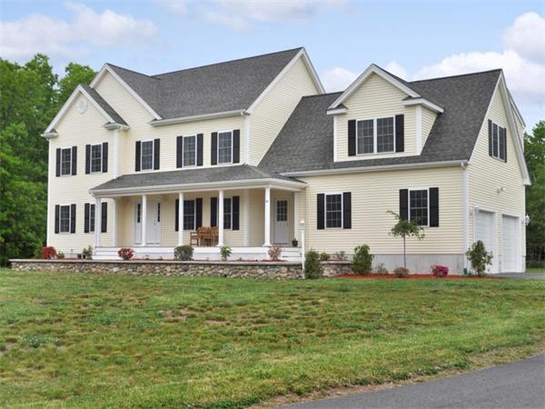 14 Hatch Road Wrentham, MA 02093 - Photo 2 of 28 a front view of a house with a garden and trees
