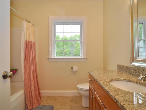 14 Hatch Road Wrentham, MA 02093 - Photo 23 of 28 a bathroom with a granite countertop sink toilet and shower