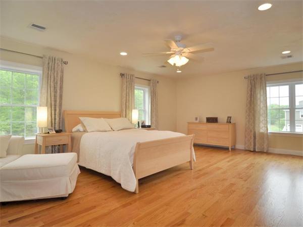 14 Hatch Road Wrentham, MA 02093 - Photo 24 of 28 a spacious bedroom with a large bed and a couch