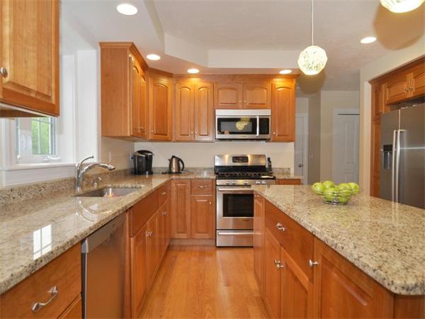 14 Hatch Road Wrentham, MA 02093 - Photo 6 of 28 a kitchen with stainless steel appliances granite countertop a sink stove and refrigerator