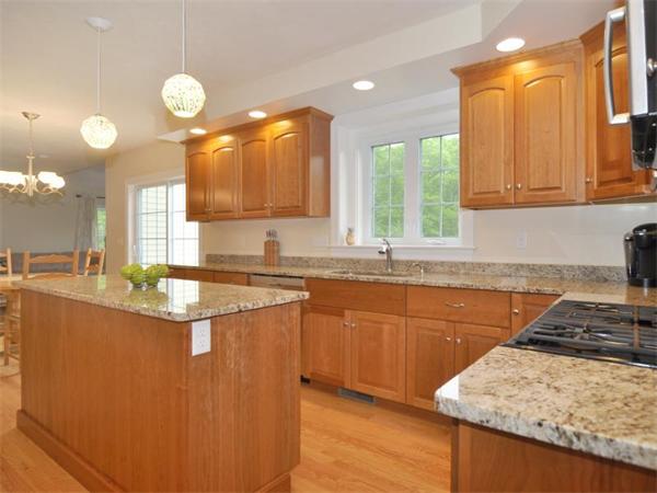 14 Hatch Road Wrentham, MA 02093 - Photo 7 of 28 a kitchen with stainless steel appliances granite countertop a sink a stove and a wooden floors
