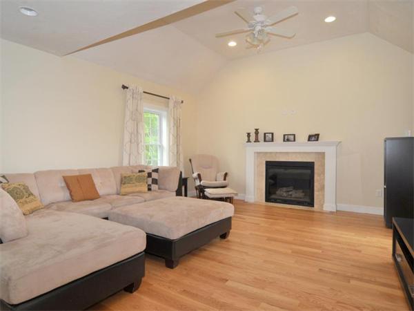 14 Hatch Road Wrentham, MA 02093 - Photo 10 of 28 a living room with furniture and a fireplace