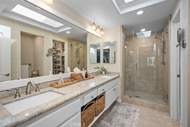 a bedroom with furniture and a large window