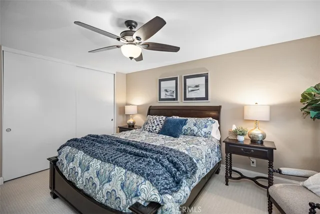 a view of a house with a yard and potted plants