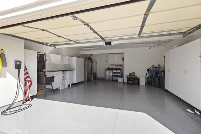 a view of a house with a backyard and a patio