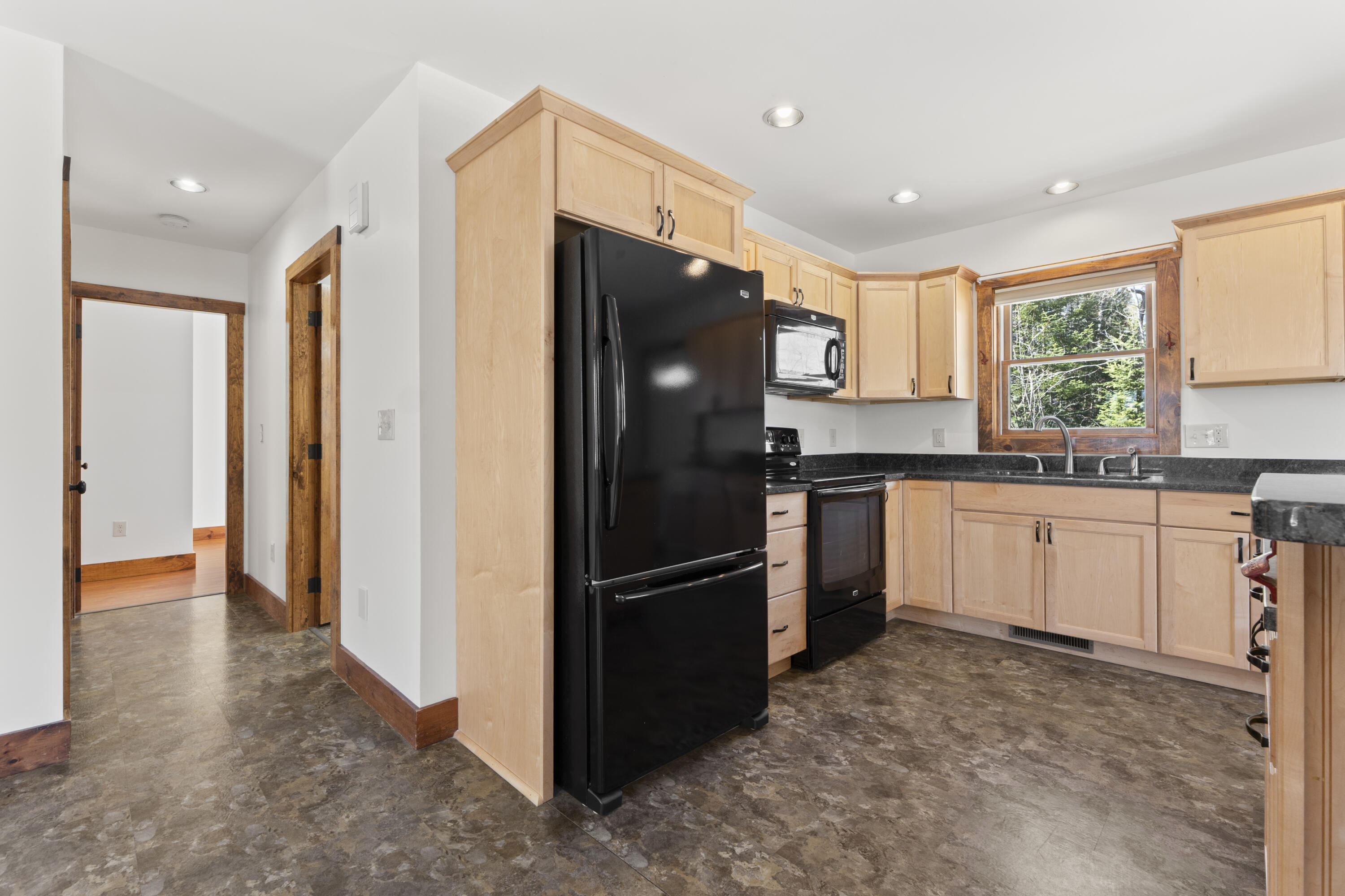 608 Waterford Road Norway, ME 04268 - Photo 8 of 47 Kitchen & Hallway to bath & 2 Bedrooms