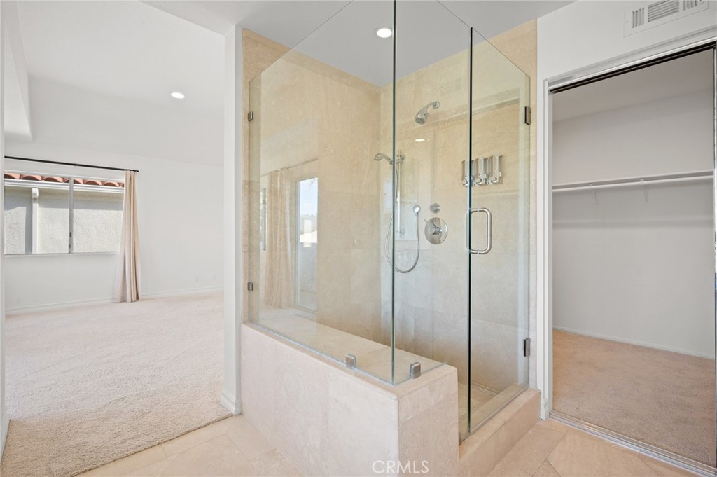 17 St John Dana Point, CA 92629 - Photo 12 of 30 a bathroom with a shower and a glass door