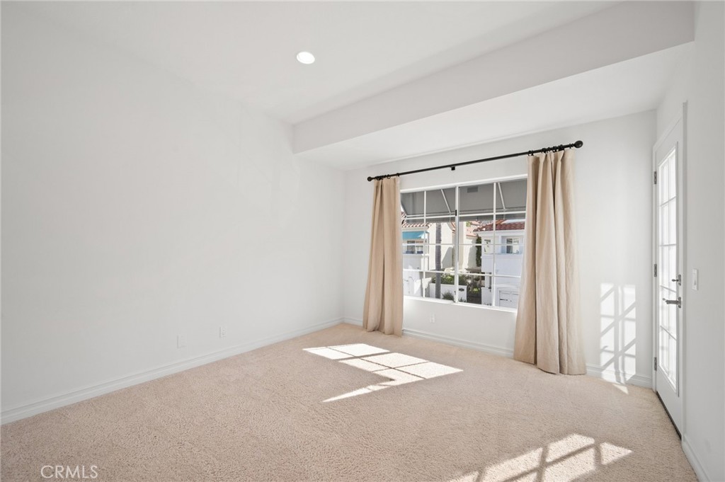 17 St John Dana Point, CA 92629 - Photo 19 of 30 a view of a room with wooden floor and windows