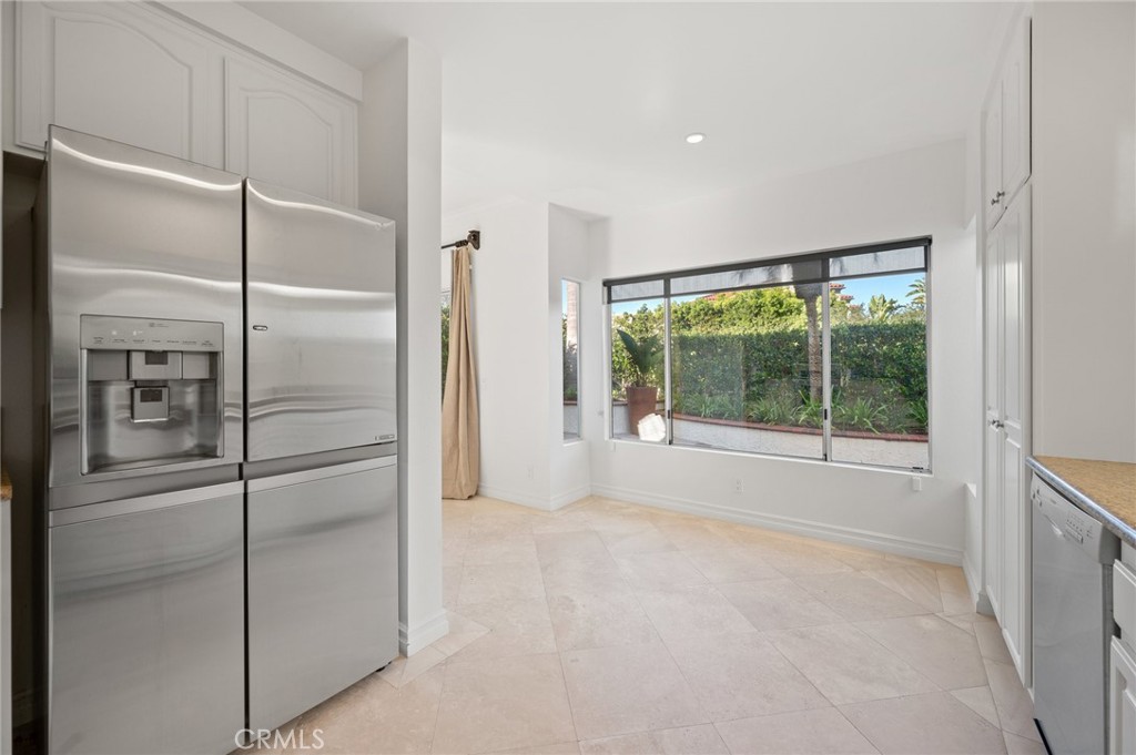 17 St John Dana Point, CA 92629 - Photo 4 of 30 a view of empty room with window and refrigerator