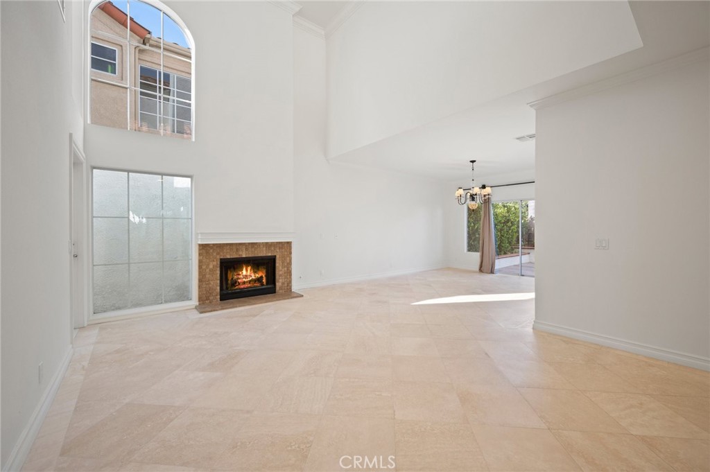 17 St John Dana Point, CA 92629 - Photo 7 of 30 a view of an empty room with a fireplace and a window