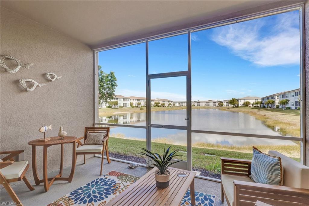 4687 Arboretum Circle, Unit 101 Naples, FL 34112 - Photo 21 of 30 a living room with furniture