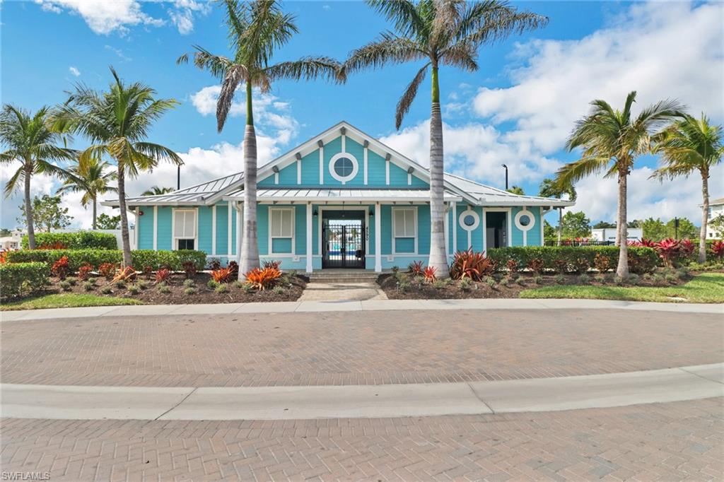 4687 Arboretum Circle, Unit 101 Naples, FL 34112 - Photo 24 of 30 front view of a house with a street