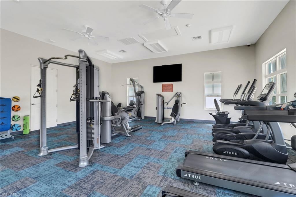 4687 Arboretum Circle, Unit 101 Naples, FL 34112 - Photo 25 of 30 a view of a room with gym equipment