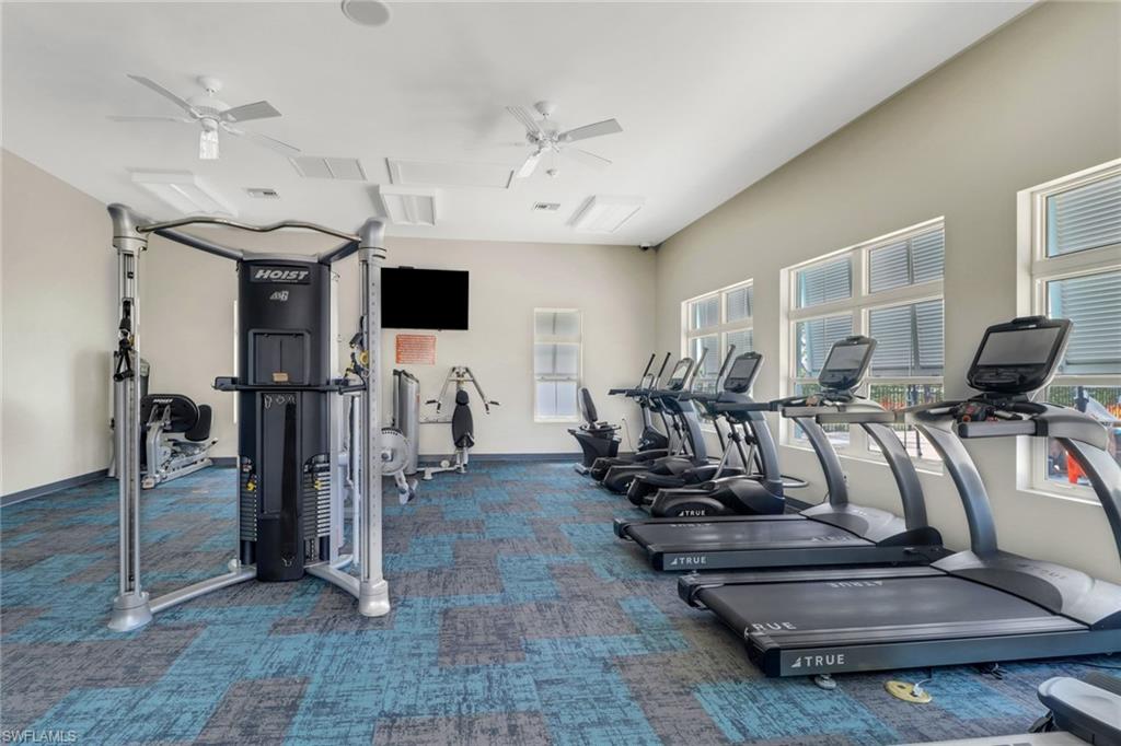 4687 Arboretum Circle, Unit 101 Naples, FL 34112 - Photo 26 of 30 a view of a room with gym equipment