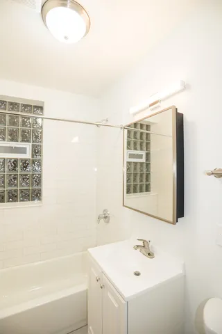 a bathroom with a sink and a bathtub