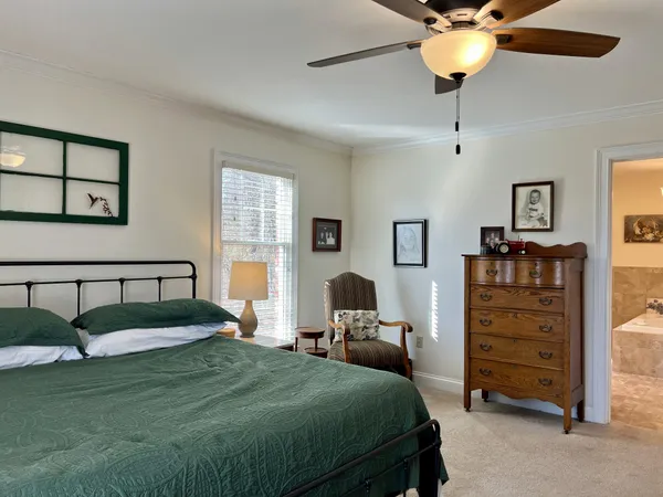 a living room with furniture and a dresser