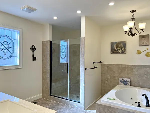 a bathroom with a sink mirror and toilet