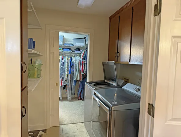 a bedroom with a bed and a table in it