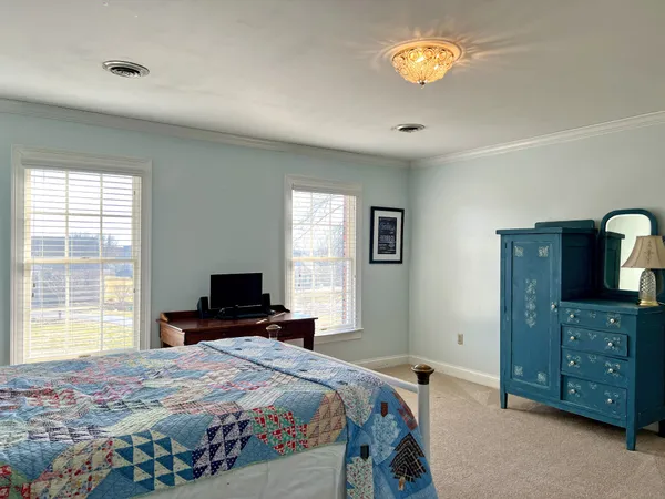a view of a hallway with wooden shelves