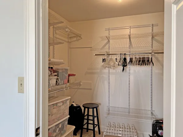 a bedroom with a bed and a closet