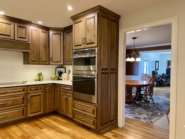 a kitchen with stainless steel appliances and cabinets