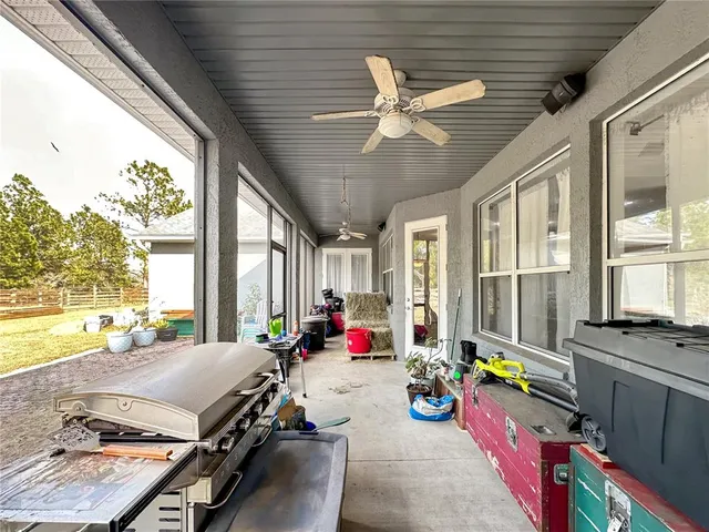 a view of a swimming pool with a yard