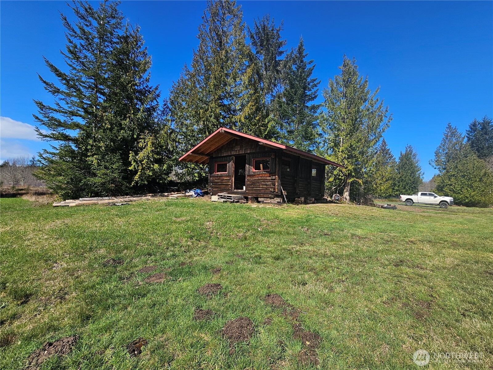 9999 Crescent Beach Road Port Angeles, WA 98363 - Photo 25 of 28 a view of a house with a yard