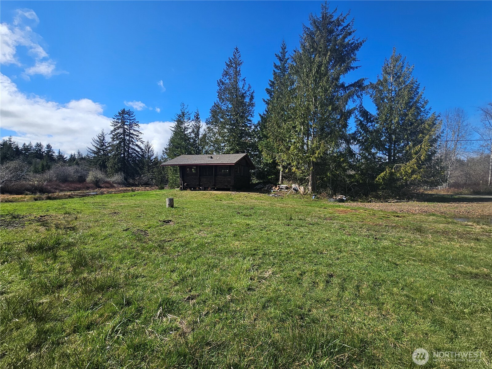 9999 Crescent Beach Road Port Angeles, WA 98363 - Photo 27 of 28 a view of a garden with a bench