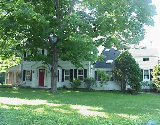 227 Brookdale Road Stamford, CT 06903 - Photo 1 of 1 a front view of a house with a garden