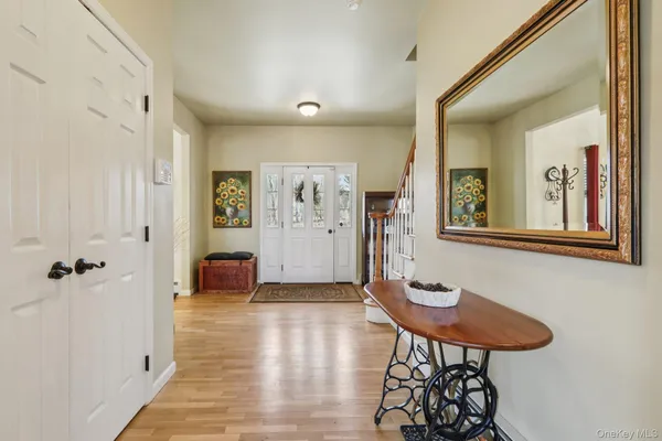 a view of a livingroom with furniture and a kitchen