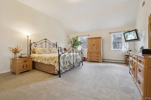 a bed room with a bed and a cabinets