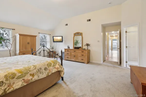 a bed room with a bed and dresser