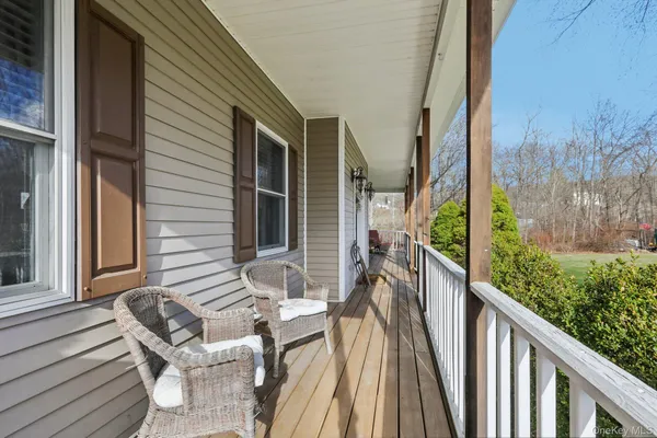 a view of balcony with furniture