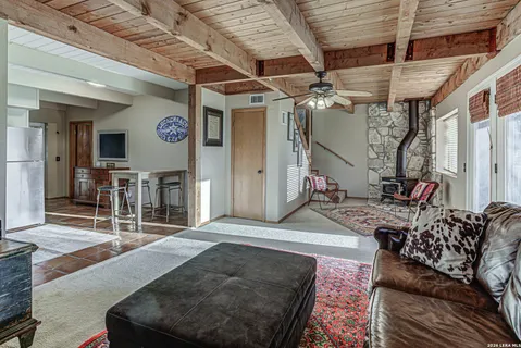 a living room with furniture and a clock