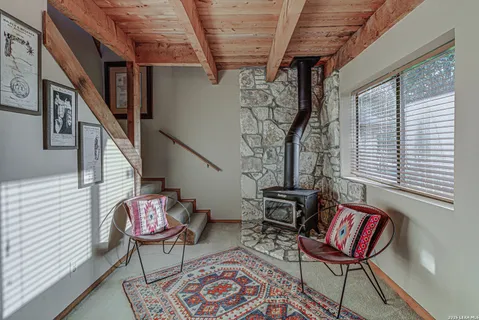 a view of a room that has a table and chairs in it