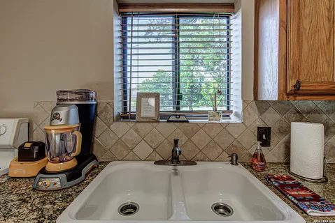 a bathroom with a tub and a window