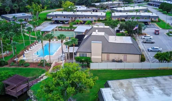 an aerial view of a house with garden space and street view