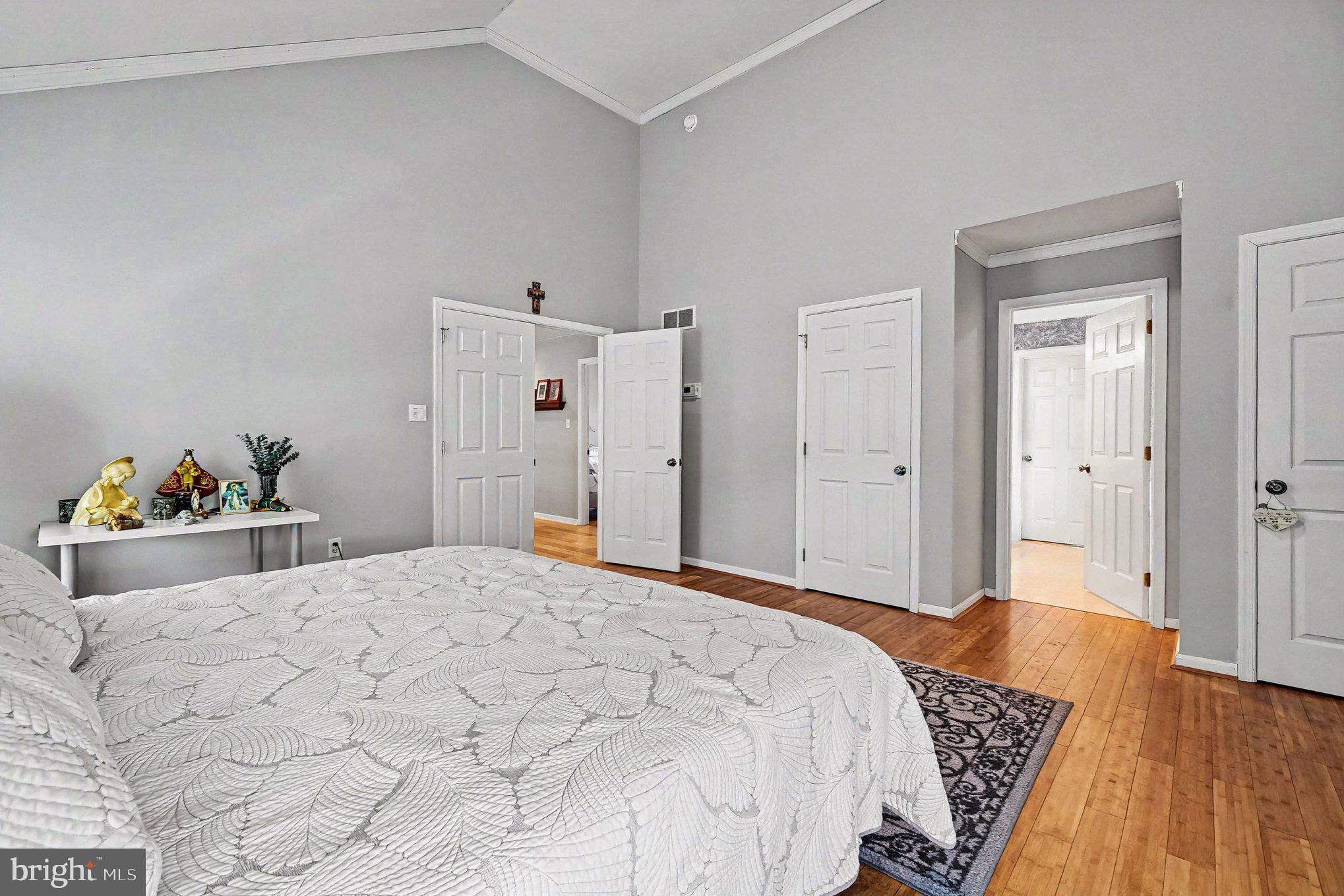 64 Open Meadow Court Elkton, MD 21921 - Photo 30 of 57 a bedroom with a bed and a wooden floor